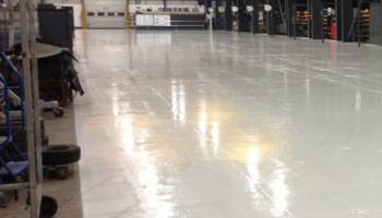 installation work carried out by flooring specialists to incorporate polymer screeds into a flooring system for a more hygienic environment