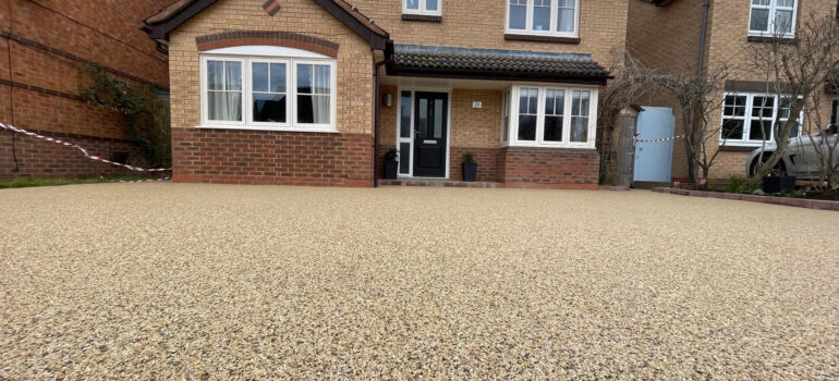 A customer's new driveway to their house after choosing resin over cement screed flooring.