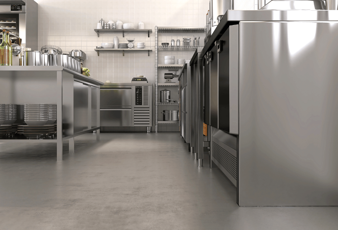 Large commercial kitchen with hygienic resin flooring.