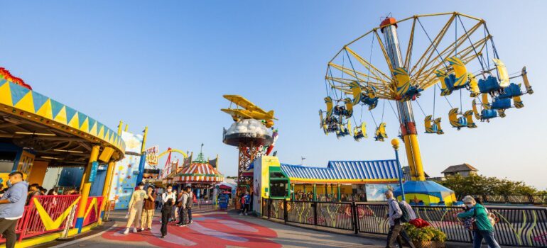 Various flooring samples like rubber, poured-in-place, and interlocking tiles, suitable for theme parks.