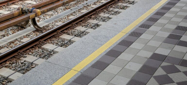 Resin flooring being used in a train station to enhance the flooring.